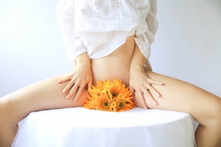 Woman with flowers in crotch - Yoni Care and Healing Vaginal Tears After Birth