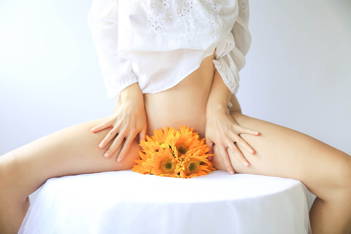 Woman with flowers in crotch - Yoni Care and Healing Vaginal Tears After Birth